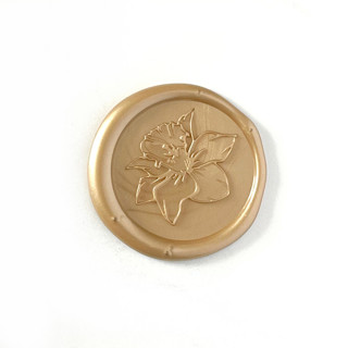 This is a gold wax seals by Abby Choi called daffodil wax seal in prosecco pack of 10 in standard