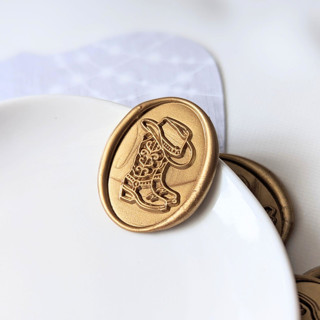 This is a gold wax seals by Inkspiringletters called cowboy boots- customizable color- set of 25 hand-crafted wax seals in standard
