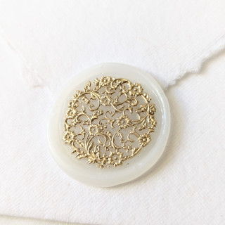This is a clear wax seals by Inkspiringletters called french lace- gilded on vellum- set of 25  hand-crafted wax seals in standard