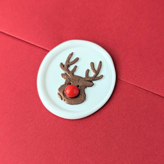 This is a white wax seals by Inkspiringletters called rudolph - set of 25 hand-crafted wax seals in standard