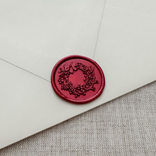 This is a red wax seals by Maria Ferrer G. called metallic red christmas wreath wax seal sticker | set of 10 in standard