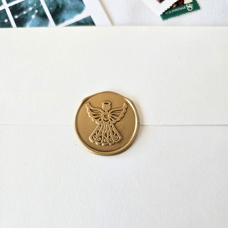 This is a multicolor wax seals by Inkspiringletters called angel topper- customizable color- set of 25 hand-crafted wax seals in standard