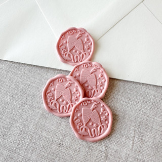 This is a pink wax seals by Maria Ferrer G. called dusty rose celebration wax seal sticker - champagne toast | set of 10 in standard