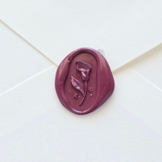 This is a purple wax seals by Inkspiringletters called calla lily- mulberry - hand-crafted wax seals- set of 25 in standard
