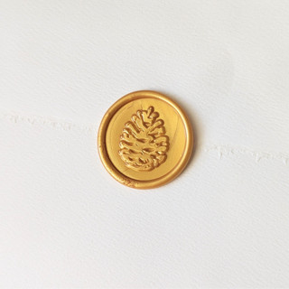 This is a multicolor wax seals by Inkspiringletters called pinecone - customizable color- set of 25 hand-crafted wax seals in standard