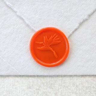 This is a orange wax seals by Inkspiringletters called birds of paradise- orange- set of 25 hand-crafted wax seals in standard