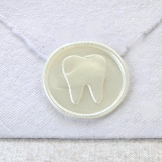 This is a multicolor wax seals by Inkspiringletters called tooth- customizable color- set of 25 hand-crafted wax seals in standard