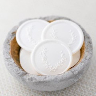 This is a white wax seals by Lindsey Cain called with love (sold in sets of 10) in standard