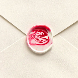 This is a multicolor wax seals by Inkspiringletters called marble- customizable color- set of 25 hand-crafted wax seals in standard