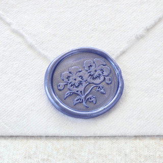 This is a multicolor wax seals by Inkspiringletters called pansies- customizable color- set of 25 hand-crafted wax seals in standard