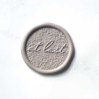 This is a gray wax seals by Abby Choi called at last in clay pack of 10 in standard