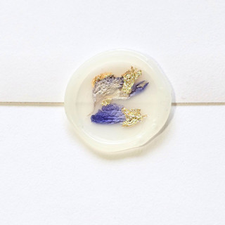 This is a multicolor wax seals by Inkspiringletters called amethyst and gold- dried and pressed florals on vellum - customizable shape- set of 25 wax seals in standard