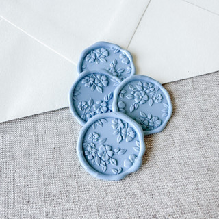 This is a blue wax seals by Orchid Studio called dusty blue floral pattern 3d wax seal stickers | set of 10 in standard