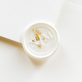 This is a white wax seals by Self Stationery called personalized wax seal stickers with custom monogram initials and gold flakes | set of 10 in standard