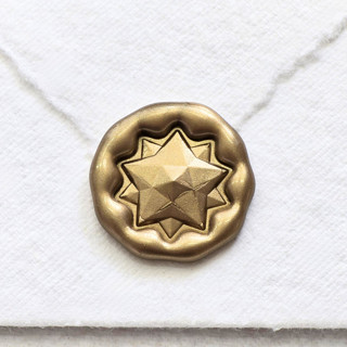 This is a multicolor wax seals by Inkspiringletters called star bow -hand-crafted wax seals - customizable color- set of 2 in standard