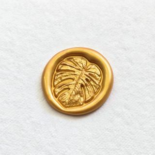 This is a multicolor wax seals by Inkspiringletters called monstera borsigiana- hand-crafted wax seals - customizable color- set of 25 in standard