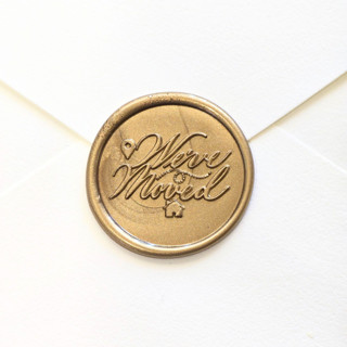 This is a multicolor wax seals by Inkspiringletters called we've moved- customizable color- set of 25 hand-crafted wax seals in standard
