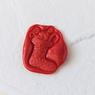 This is a red wax seals by Inkspiringletters called stocking-customizable color - set of 25  hand-crafted wax seals in standard