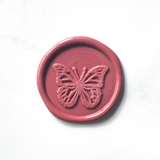 This is a pink wax seals by Abby Choi called butterfly in rose pack of 10 in standard
