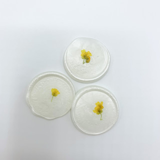 This is a white wax seals by Christine OMalley called pressed flower ivory wax seal yellow flowers set of 6 in standard