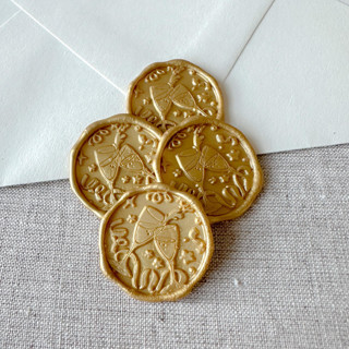 This is a gold wax seals by Maria Ferrer G. called classic gold celebration wax seal sticker - champagne toast | set of 10 in standard
