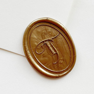 This is a gold wax seals by Self Stationery called personalized oval wax seal stickers with custom monogram, handmade, custom colors, set of 10 in standard