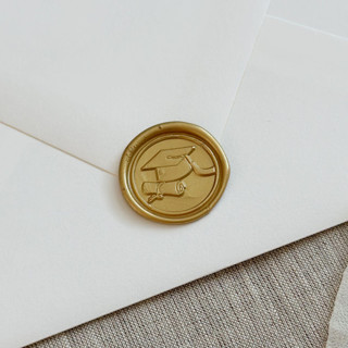 This is a gold wax seals by Maria Ferrer G. called classic gold graduation wax seal stickers | set of 10 in standard