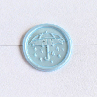 This is a multicolor wax seals by Inkspiringletters called april showers- customizable color- set of 25 hand-crafted wax seals in standard