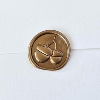 This is a multicolor wax seals by Inkspiringletters called acorns- customizable color- set of 25 hand-crafted wax seals in standard