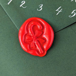 This is a multicolor wax seals by Inkspiringletters called candy cane- - holiday wax seals- customizable color- set of 25 hand-crafted wax seals in standard