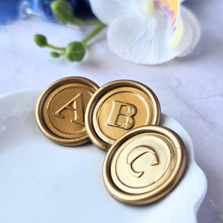 This is a multicolor wax seals by Inkspiringletters called serif  monogram (a-z) - customizable color- set of 25 hand-crafted wax seals in standard