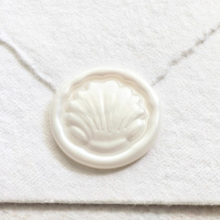 This is a multicolor wax seals by Inkspiringletters called dome shell- hand-crafted wax seals - customizable color- set of 25 in standard