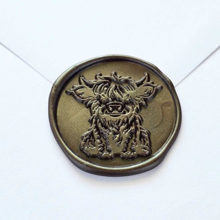 This is a multicolor wax seals by Inkspiringletters called highland cow - customizable color- set of 25 hand-crafted wax seals in standard