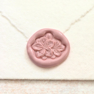 This is a multicolor wax seals by Inkspiringletters called azalea-customizable color- hand-crafted wax seals - set of 25 in standard
