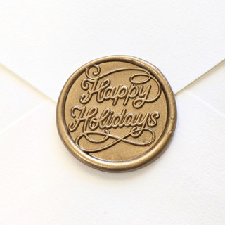 This is a multicolor wax seals by Inkspiringletters called happy holidays- customizable color- set of 25 hand-crafted wax seals in standard