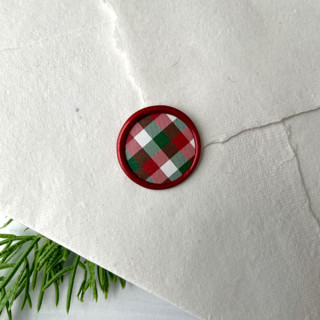 This is a red wax seals by Honey Silks Co called gingham holiday wax seal - set of 10 in standard