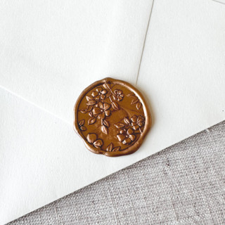 This is a gold wax seals by Maria Ferrer G. called antique gold floral pattern 3d wax seal stickers | set of 10 in standard