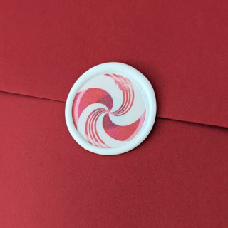 This is a white wax seals by Inkspiringletters called peppermint swirl- - holiday wax seals- set of 25 white/red  hand-crafted wax seals in standard