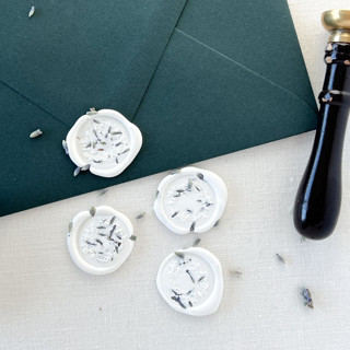 This is a white wax seals by Eva Friesen called lavender floral wreath self-adhesive wax seal | set of 6 in standard