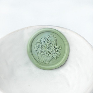 This is a multicolorassorted-colors wax seals by Abby Choi called flower basket wax seals, pack of 10, customizable color in standard