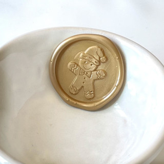 This is a multicolorassorted-colors wax seals by Abby Choi called gingerbread wax seal, pack of 10, customizable color in standard