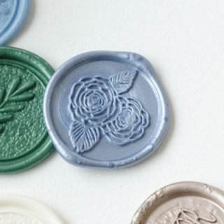 This is a multicolorassorted-colors wax seals by Self Stationery called custom color and icon self adhesive wax seal sticker | set of 10 in standard