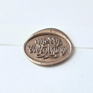 This is a multicolor wax seals by Inkspiringletters called merry everything- customizable color- set of 25 hand-crafted wax seals in standard