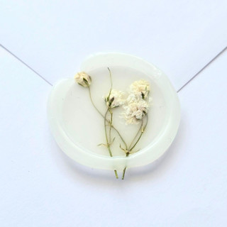 This is a multicolor wax seals by Inkspiringletters called pressed baby's breath - customizable colors- set of 25 hand-crafted wax seals in standard