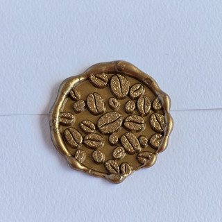 This is a multicolor wax seals by Inkspiringletters called coffee beans- customizable color- set of 25 hand-crafted wax seals in standard