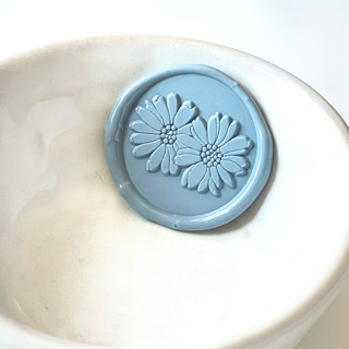 This is a multicolorassorted-colors wax seals by Abby Choi called double daisy wax seal, pack of 10, customizable color in standard