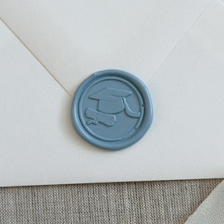 This is a blue wax seals by Maria Ferrer G. called dusty blue graduation wax seal stickers | set of 10 in standard