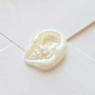 This is a multicolor wax seals by Inkspiringletters called conch - customizable color - hand-crafted wax seals- set of 25 in standard