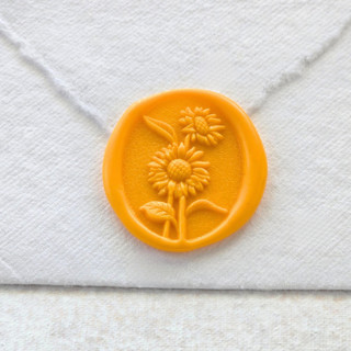 This is a yellow wax seals by Inkspiringletters called sunflower- sunshine yellow- set of 25 hand-crafted wax seals in standard