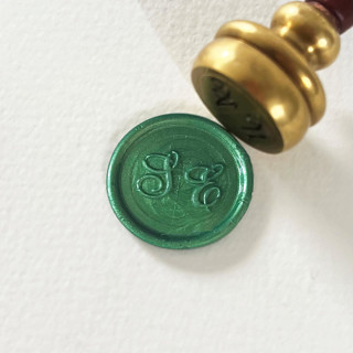 This is a green wax seals by Self Stationery called customizable color, hand-crafted wax seal stickers | set of 10 in standard